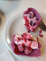 Breakfast for two: scrambled eggs, hash browns, black coffee, cappuccino, dessert