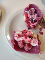 Breakfast for two: scrambled eggs, hash browns, black coffee, cappuccino, dessert