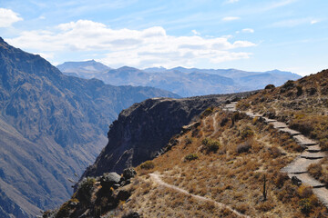 Fototapeta premium Hiking trail and footpath up in the mountains to a viewing point where you can spot condors. Photo taken in Colca Canyon, Peru