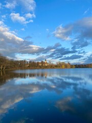 Obraz na płótnie Canvas Blue lake with reflection near forest 