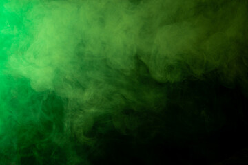 Green smoke on black background