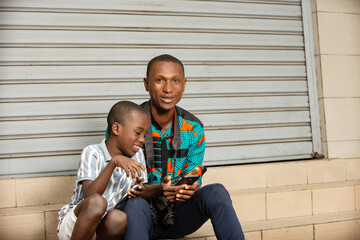 portrait of a happy family with mobile phone.