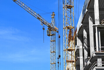 Crane and highrise construction site