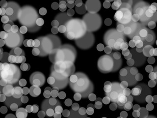 Defocused white lights over dark background. Abstract background. Multi-layered effect.