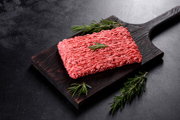Fresh raw beef mince on a dark background