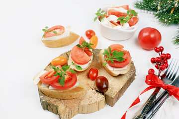 Caprese and Toast bruschetta with mozzarella cheese, cherry tomatoes and fresh garden basil. Traditional Italian food, healthy natural breakfast, cholesterol and GMO free, space for text