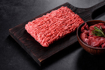Fresh raw beef mince on a dark background