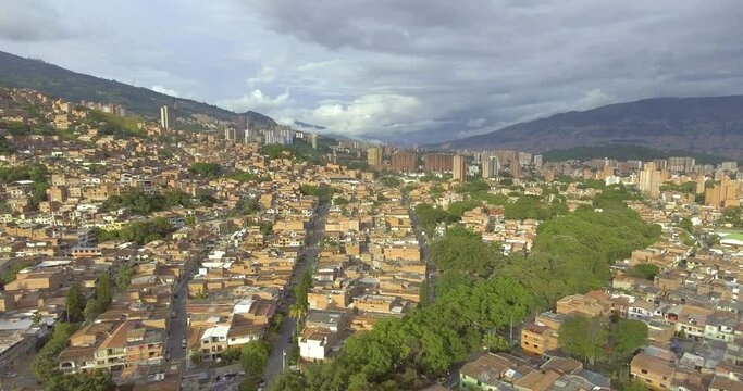 Beautiful Medell&iacute;n, Antioquia, Colombia Cityscape with Houses, Buildings, Towers and Lots of Trees on a Cloudy Day