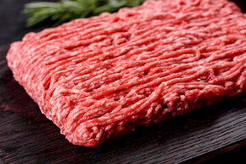 Fresh raw beef mince on a dark background