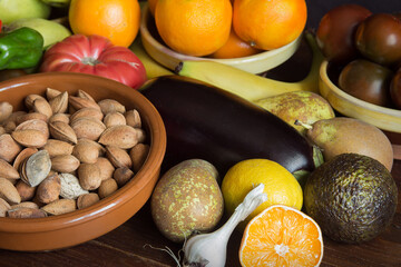 Group of organic natural foods, fruits, and vegetables on a wooden table. Healthy ingredients.