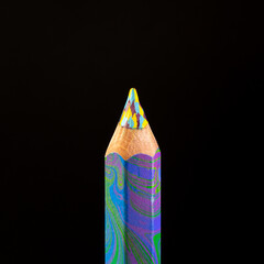 Colorful pencil close-up on the black backdrop.
