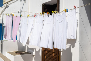 Clothes drying in the sun on a street in Greece