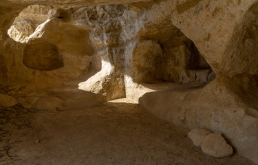 Stunning Roman catacombs carved on the sandstone cliffs above the Matala Beach, Crete, Greece. In Roman times, the dead were buried in them, later they were used by the first Christians