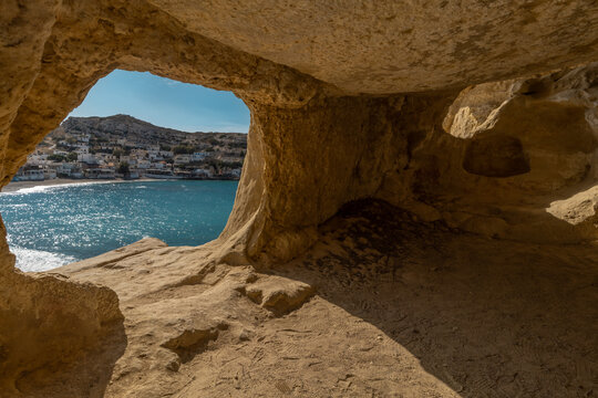 Stunning Roman catacombs carved on the sandstone cliffs above the Matala Beach, Crete, Greece. In Roman times, the dead were buried in them, later they were used by the first Christians