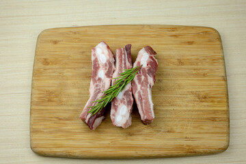 raw pork ribs with rosemary