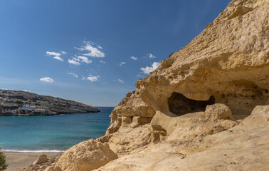 Stunning Roman catacombs carved on the sandstone cliffs above the Matala Beach, Crete, Greece. In Roman times, the dead were buried in them, later they were used by the first Christians