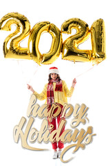  woman in santa hat and scarf holding balloons with 2021 numbers near happy holidays lettering on white
