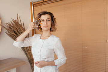 doctor beautician in a white coat. cosmetology procedures. The doctor gives injections