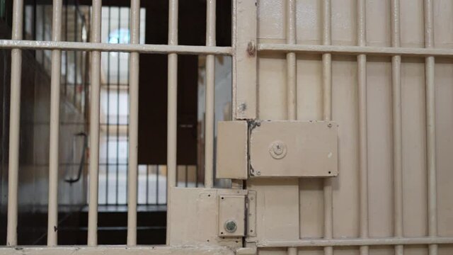 steel door with a large lock in the prison. secure entrance to the prison corridor