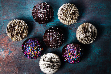 Cocoa bomb that melts with hot milk. Chocolate and cookies and cream flavor with colorful...