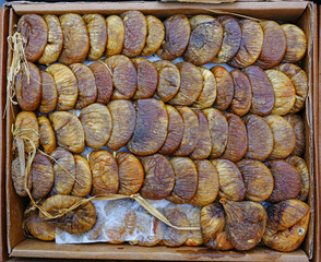 Box of plump dried figs at a market