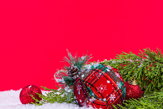 close-up red christmas decorations and snow