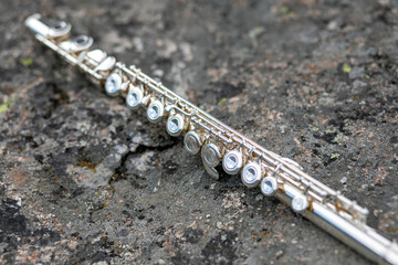 a flute lying on the asphalt track during marching band camp