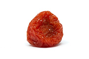 Rotten red cherry tomato on whote background. Studio shot of a vegetable