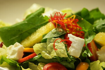 Fruits and vegetable salad close up. Tasty dish at vegetarian restaurant. Healthy eating concept.
