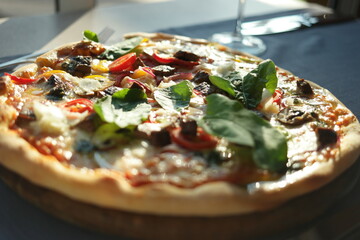 Close up of freshly baked Italian pizza. Tasty pizza at restaurant. Italian pizza recipe.
