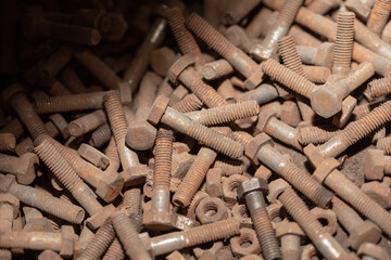 pile of old rusty bolts and nuts