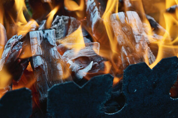 close up of burning wood and charcoal