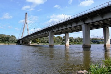 Swietokrzyski Bridge over Vistula river, Warsaw, Poland. Modern, cable-stayed bridge with single tower and cables attached supporting the deck. 