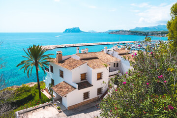 Traditional white houses with unspoilt idyllic view of marina, coastline and Mediterranean Sea in...