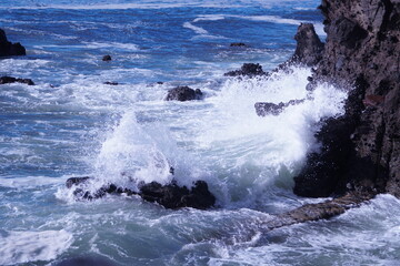 waves crashing on rocks