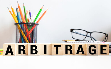 ARBITRAGE word made with building blocks