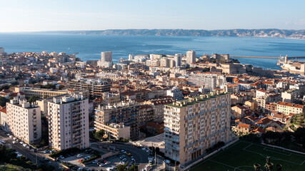 Cityscape of Marseille. View from Notre-Dame de la Garde at the highest natural point in Marseille. Mediterranean sea in the background.