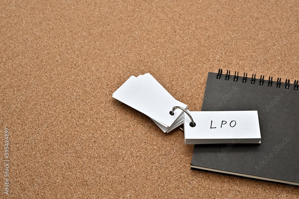 Fototapete on top of the notebook on the cork board is a wordbook with the word lpo written on it. it means lan