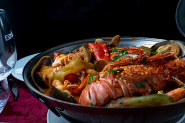 Seafood cataplana, typical Portuguese dish, with lobster, shrimps, mussels, vegetables.
