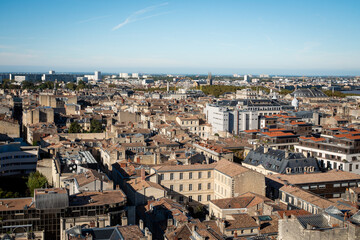 Fototapeta na wymiar Cityscape of Bordeaux, a port city on the Garonne in the Gironde department in Southwestern France. Sunny day, blue sky.