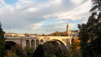 Fototapeta premium The Adolphe Bridge is a double-decked arch bridge in Luxembourg City, in southern Luxembourg, in Europe. Photographed during autumn. Cloudy sky. 