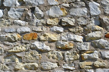 Old, white stone brick wall. Natural background, texture. Wall made of limestone