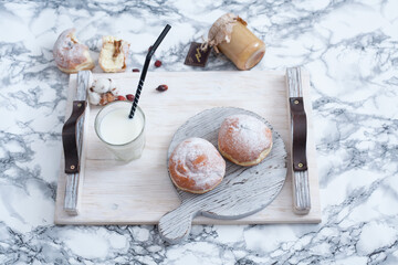 americano with milk black coffee and donut in a wood tray
