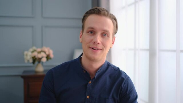 Portrait of young handsome man talk or conversation with camera like online meeting with friends or other co-worker for new normal lifestyle during pandemic of infectious disease.