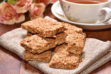  Crunchy granola bars on a wooden background   