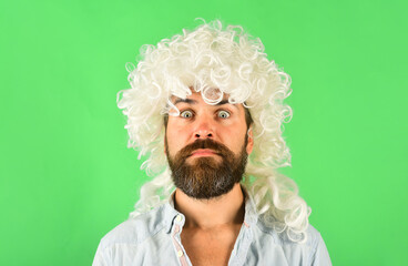 Emotions. Surprised man in wig. Surprised bearded man. Portrait of surprised man. Isolated. Wig.