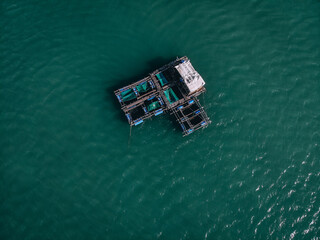 Aerial drone top view photo of large fishing boat cruising with  fishing net to catch fish