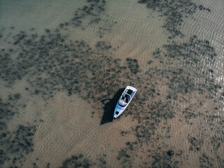 Beautiful Aerial view of an Aground motorboat on the reef barrier