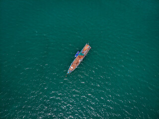 Aerial view from drone, Thai fishing boat used as a vehicle for finding fish in the sea, Thailand .