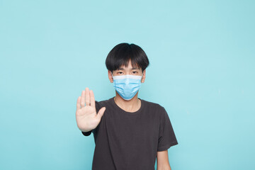 young man wearing disposable face medical mask